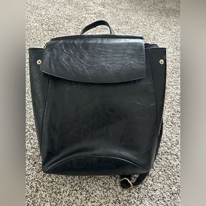 Small backpack/purse. Black with adjustable straps.